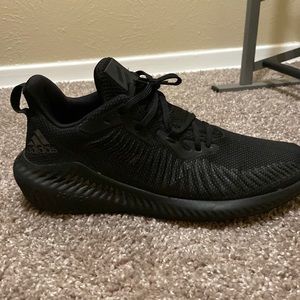 Black adidas running shoes